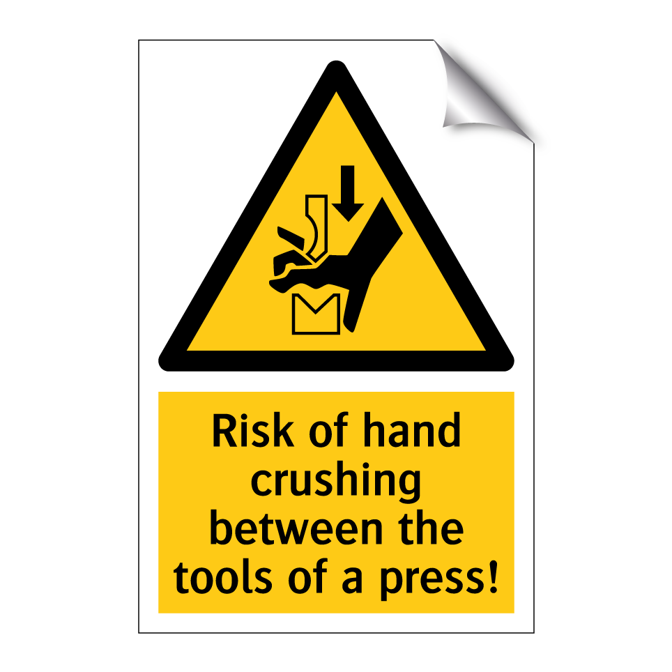 Risk of hand crushing between the tools of a press!